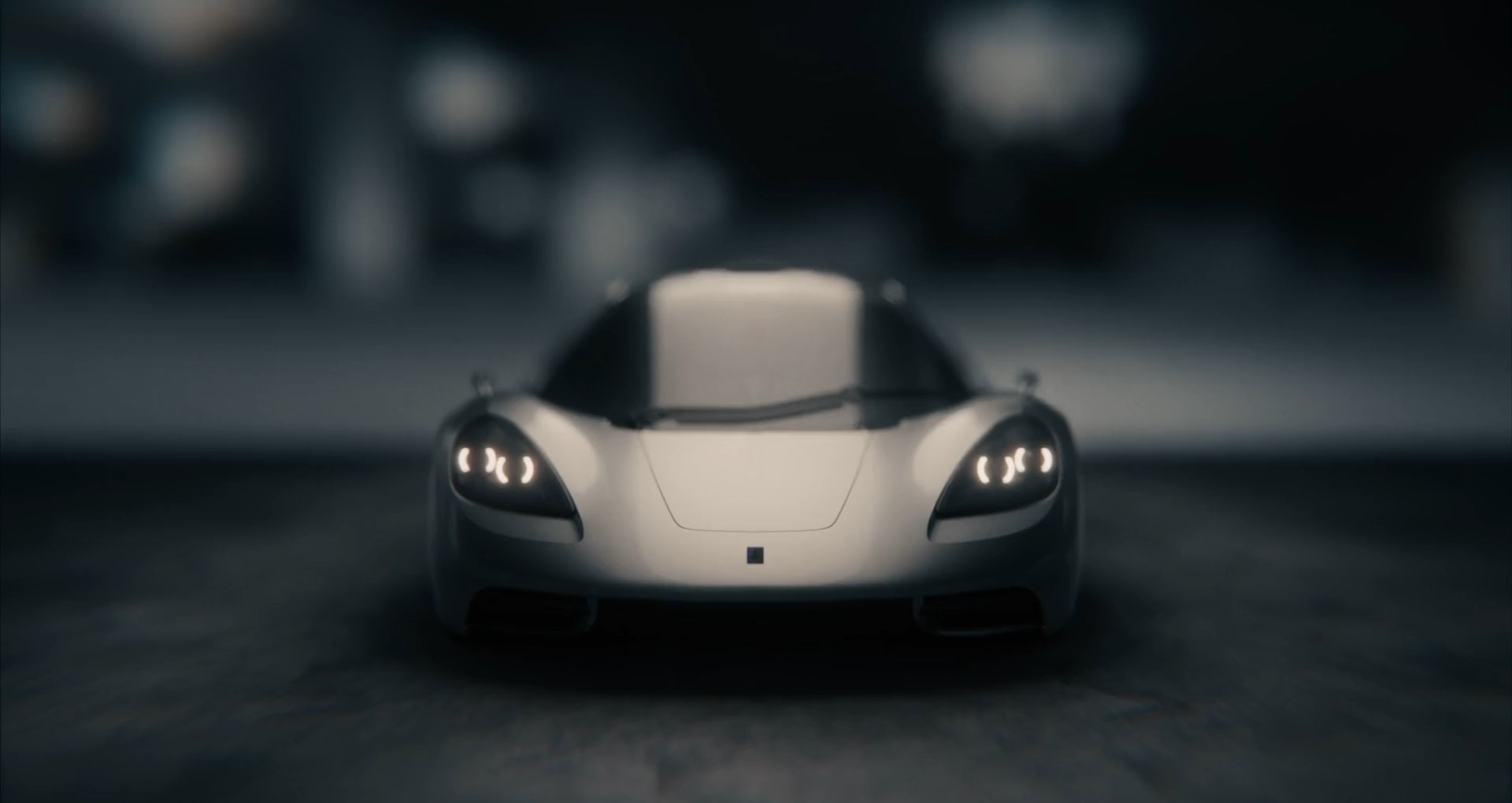 Silver McLaren in dark cinematic setting